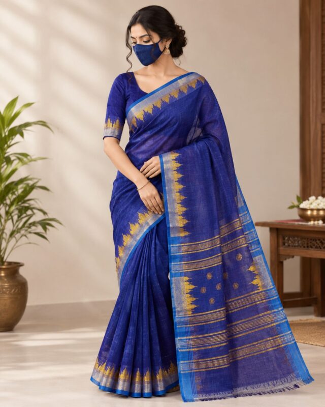 A professional website product photo displaying a beautiful handwoven royal blue premium cotton Manipuri saree from Bilashini.